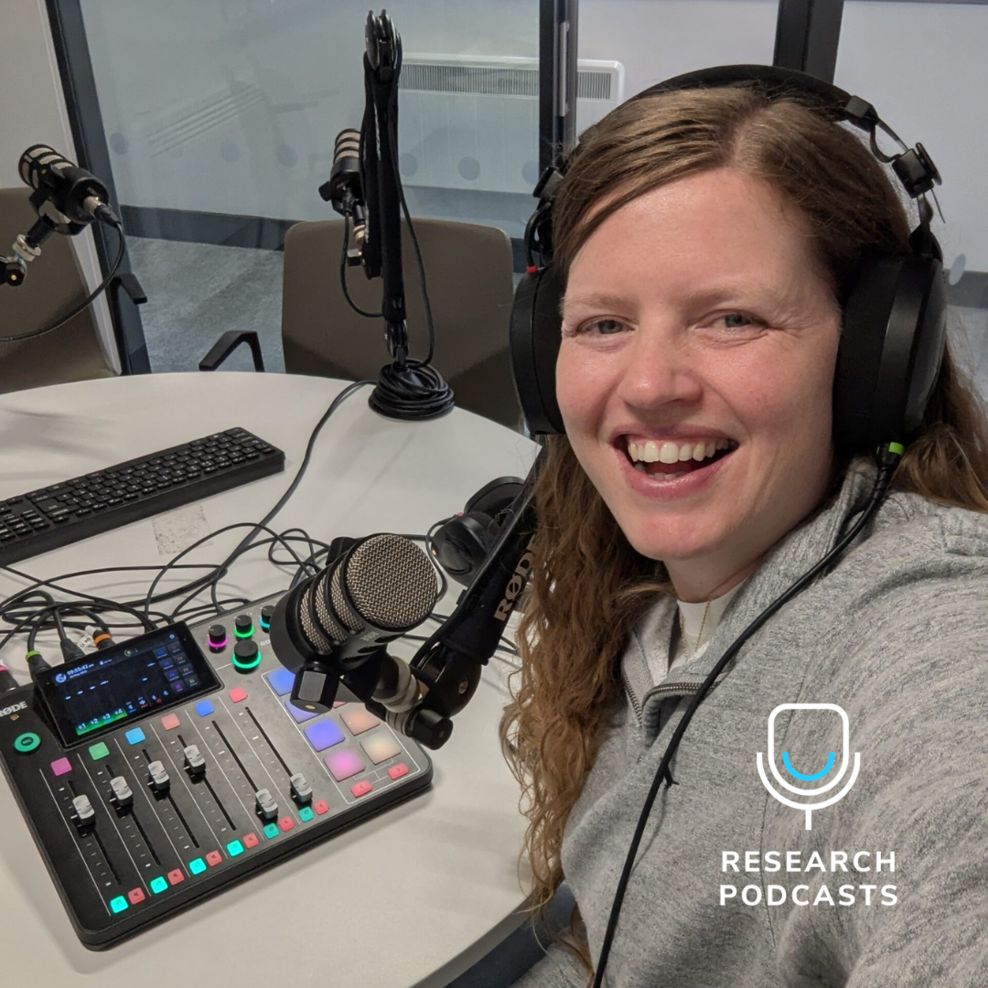Krissie Brighty-Glover in a podcast studio smiling at the camera. Research Podcasts Logo in the bottom right hand corner